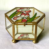 Glass box and hexagonal brass enamelled floral decoration