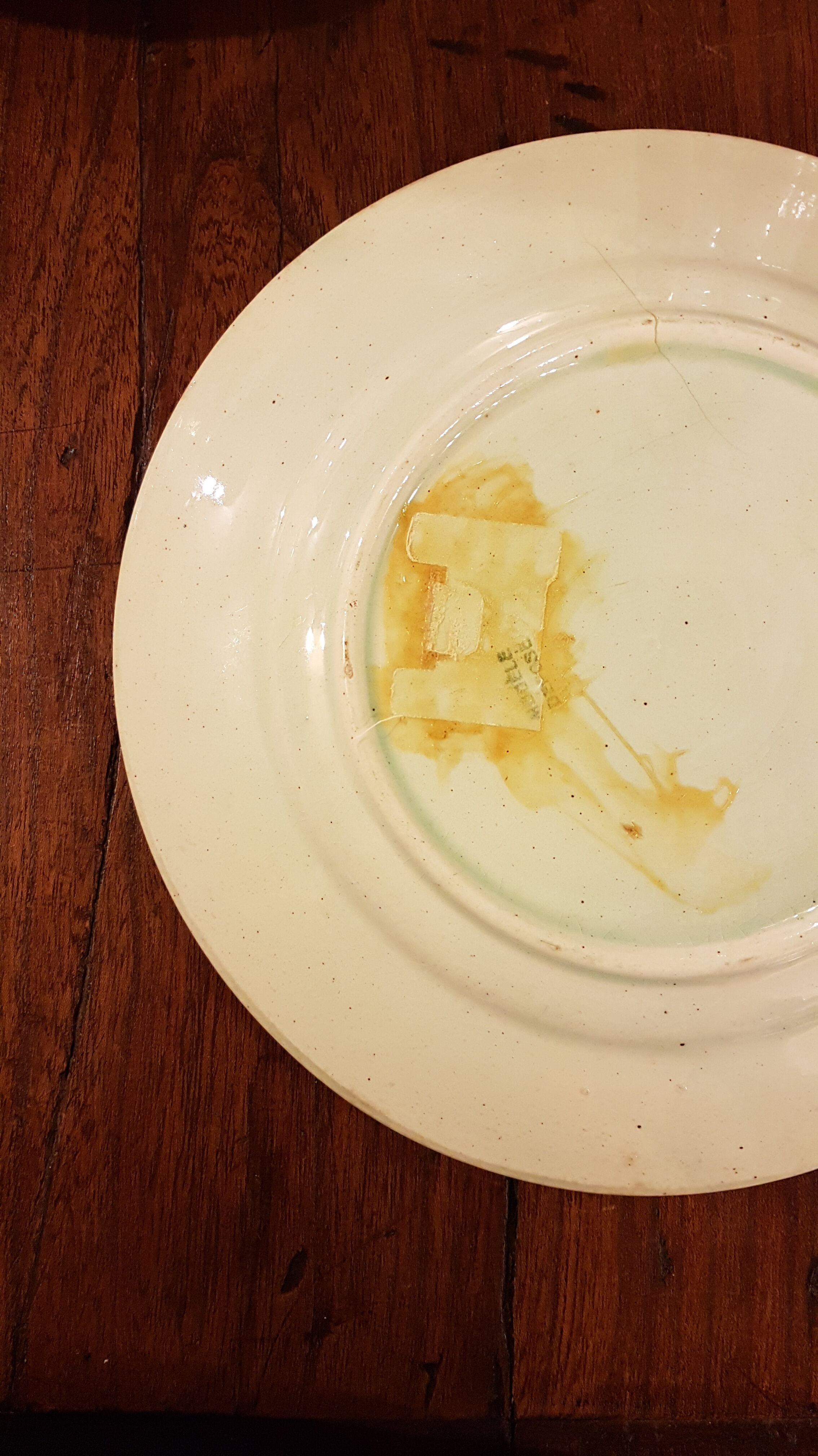 Old plate with decoration of raspberries