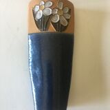 Vase in reeds with stylized flowers