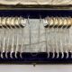 Service of 12 silver-plated metal coffee spoons with tongs and box from around 1900.