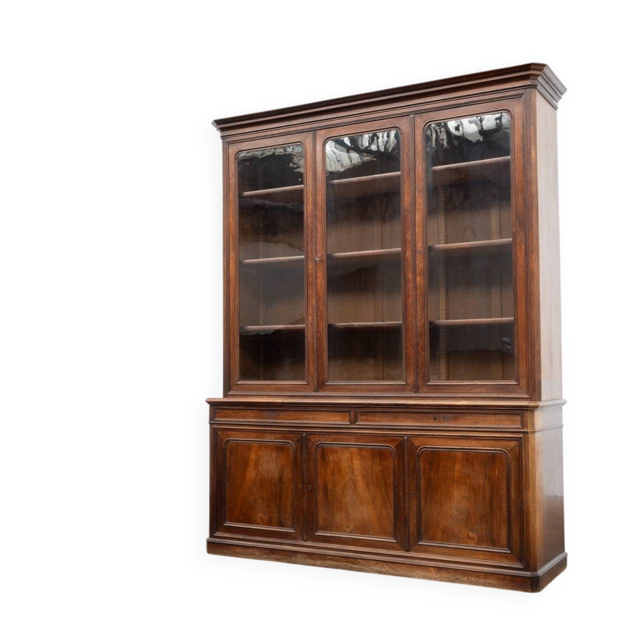 Large glass-fronted library in rosewood from the 19th century.