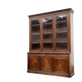 Large glass-fronted library in rosewood from the 19th century.