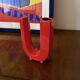 Space age red U letter ceramic solifleur vase, Marcel Radureau Francia 1970