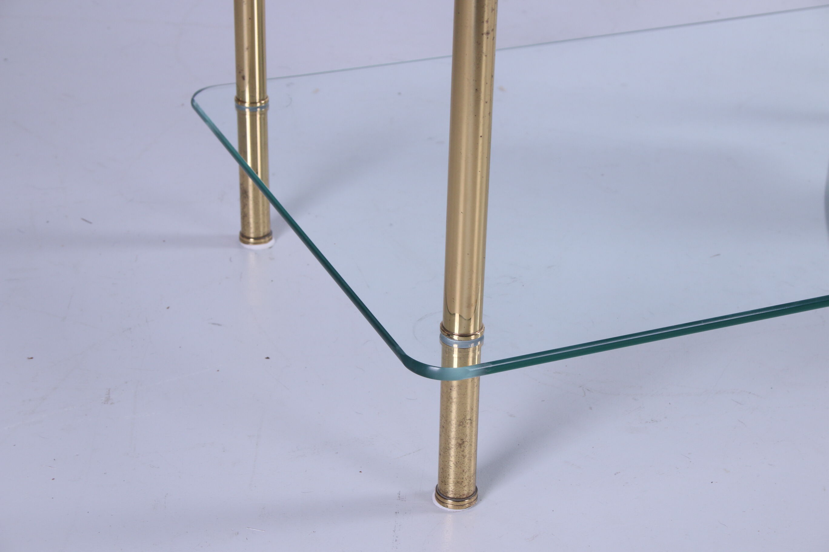 Hollywood Regency side table with gold-colored legs