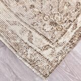 Tapis vintage à motifs floraux beige et marron