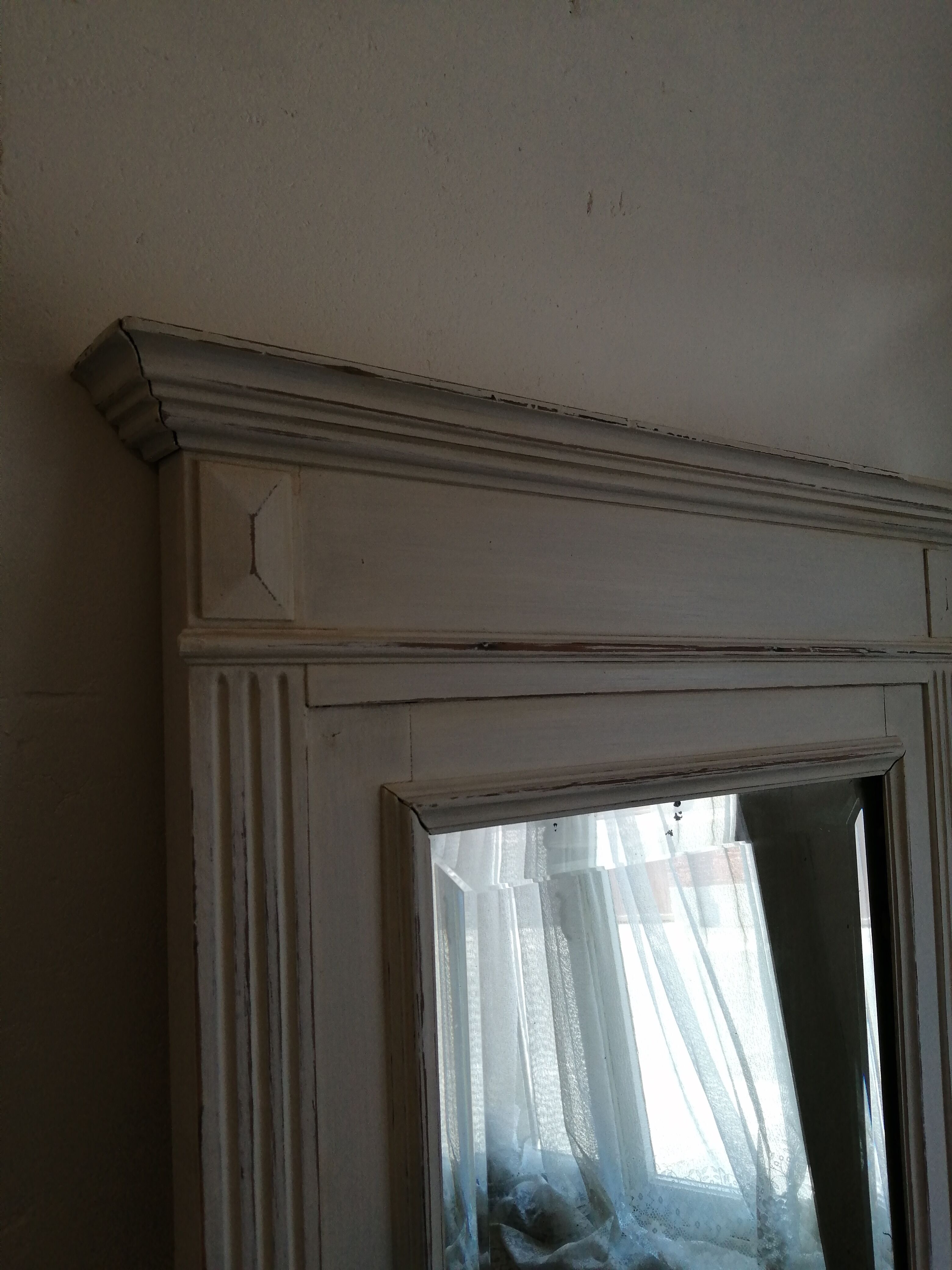 Beveled fireplace mirror