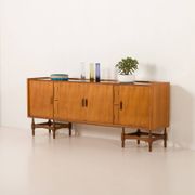 Itaian mid century teak sideboard with black glass top and inlays, 1970s