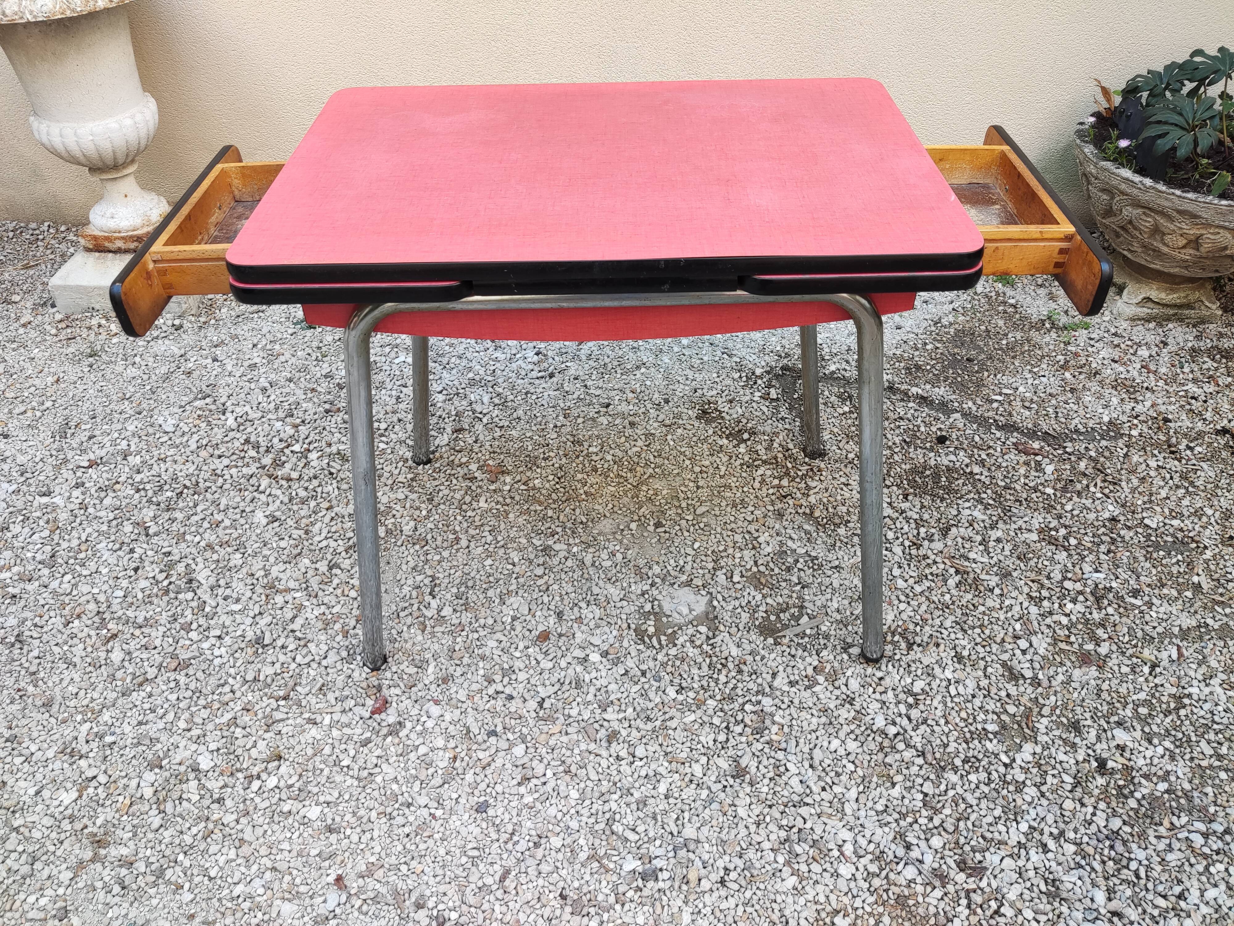 Table with two stools in red formica