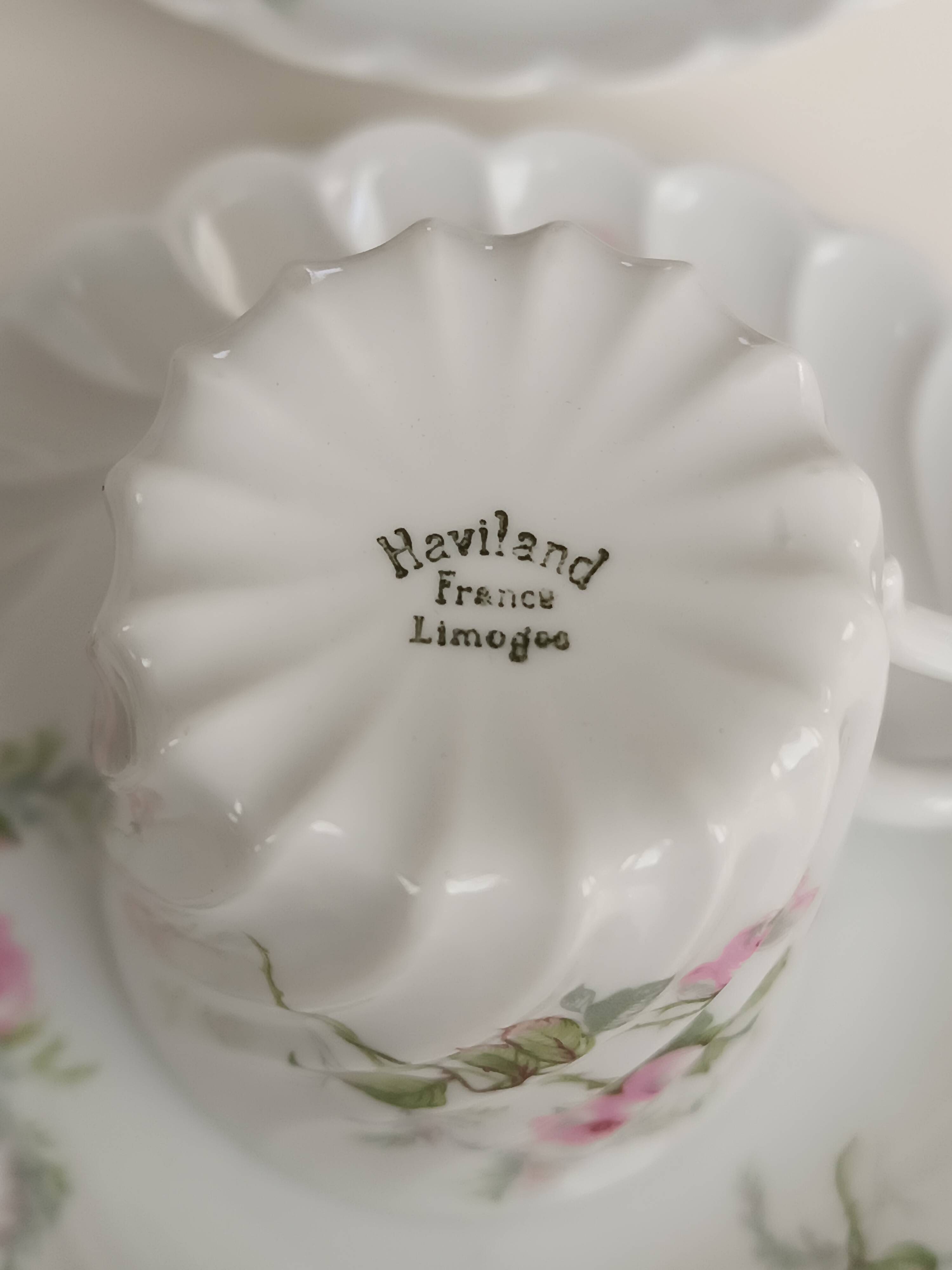 Haviland Limoges porcelain 10 coffee cups and 9 saucers with floral decoration.