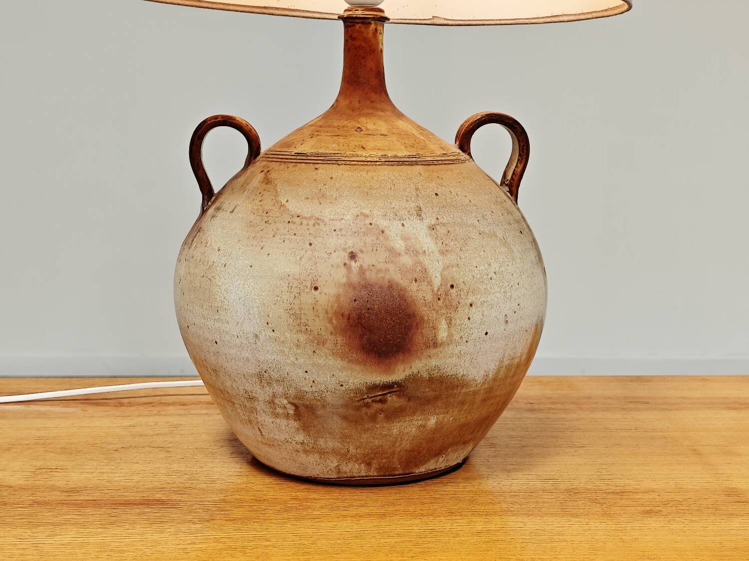 Modernist ceramic sandstone lamp with two handles from the 1950s