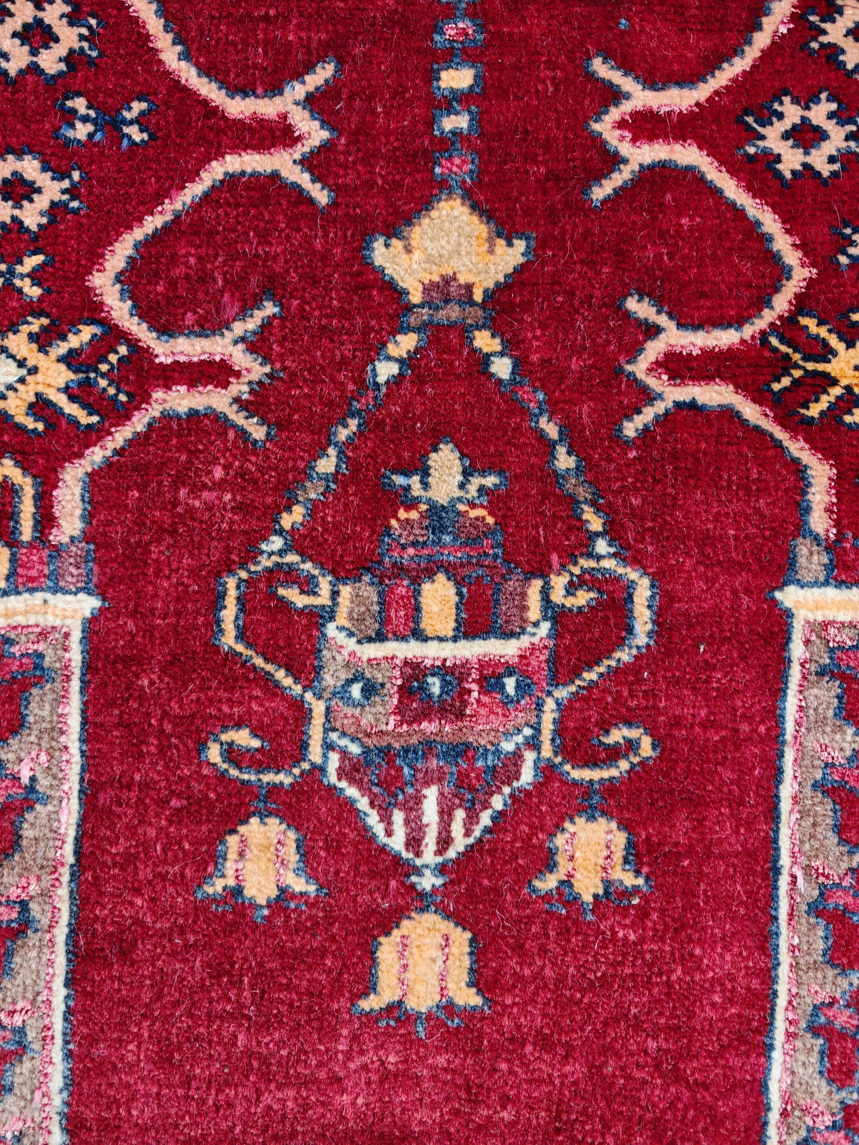 Vintage Afghan hand-knotted prayer rug with Islamic patterns.