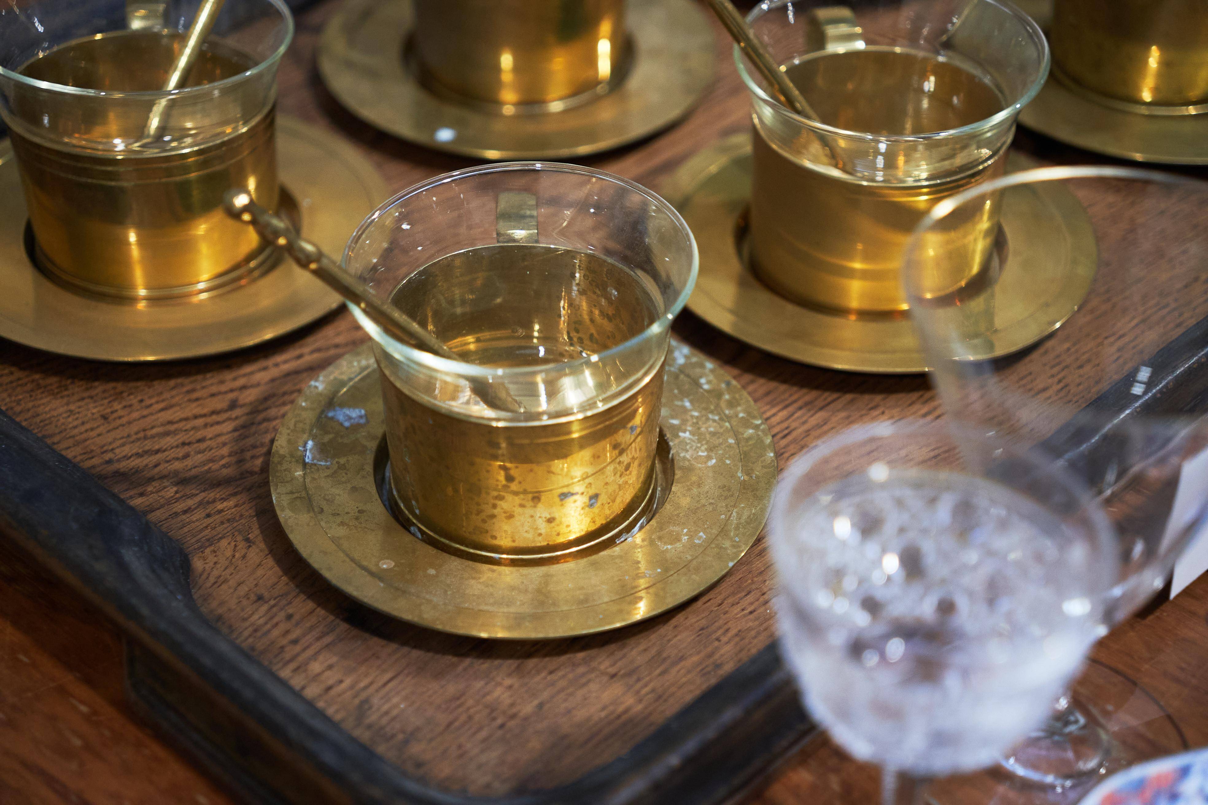 Mid-century tea service in patinated brass and glass