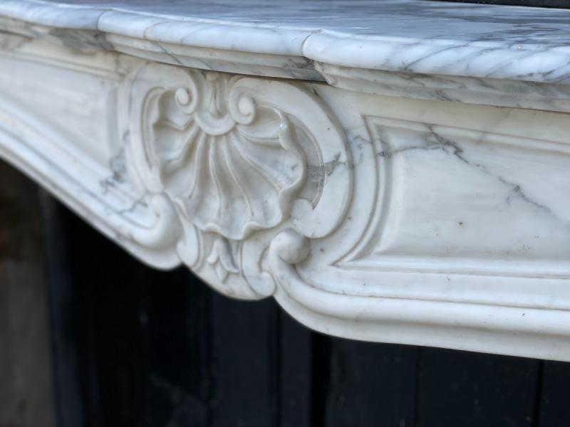 Louis XV style fireplace in white Carrara marble arabescato