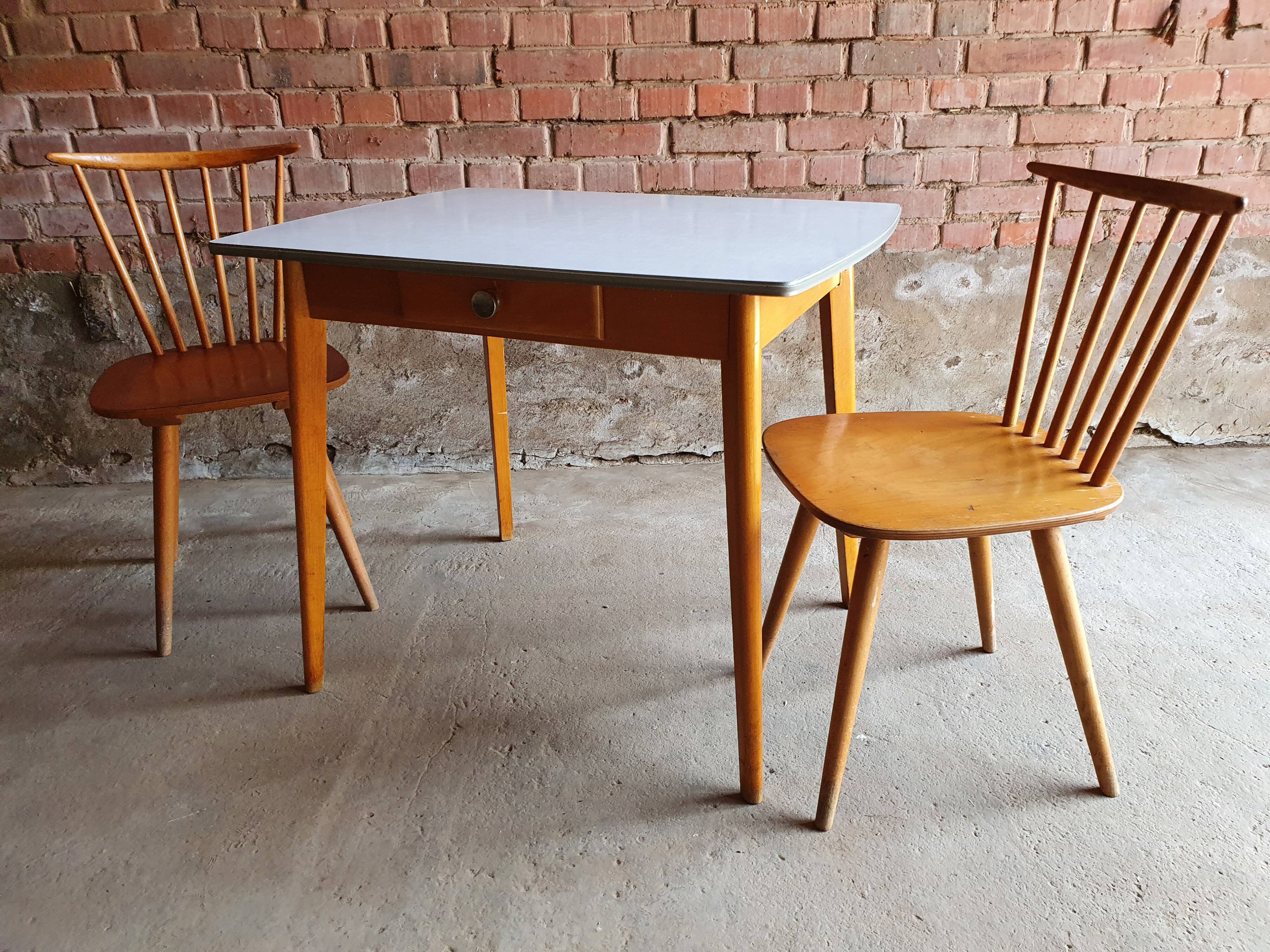 Together two Scandinavian chairs and its wooden and formica table