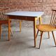 Together two Scandinavian chairs and its wooden and formica table