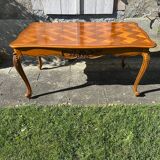 Antique extendable table in cherry wood and marquetry in the Louis XV style.