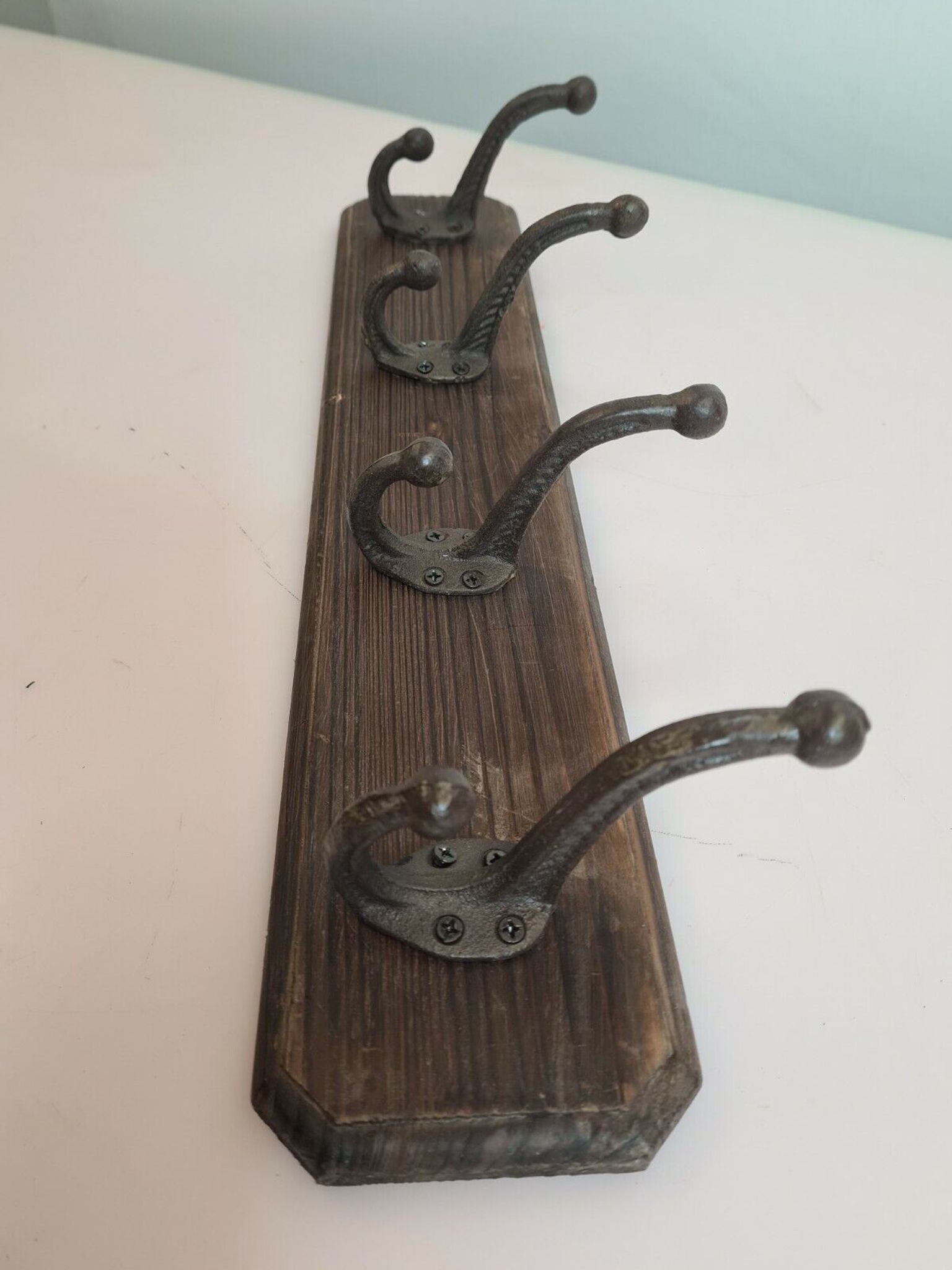 Wooden school coat rack with cast iron hooks