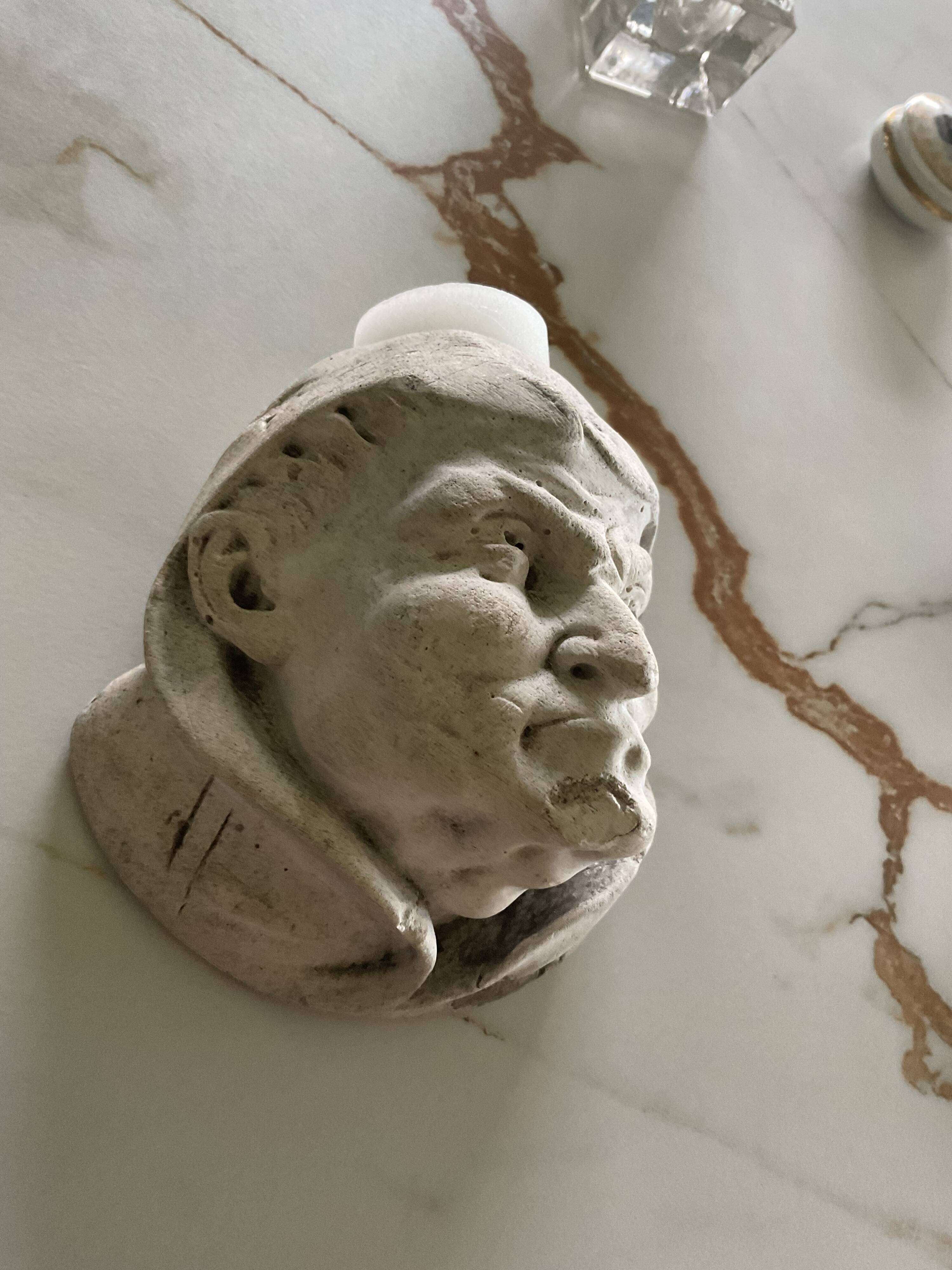 Monk's head candlestick. Antique.