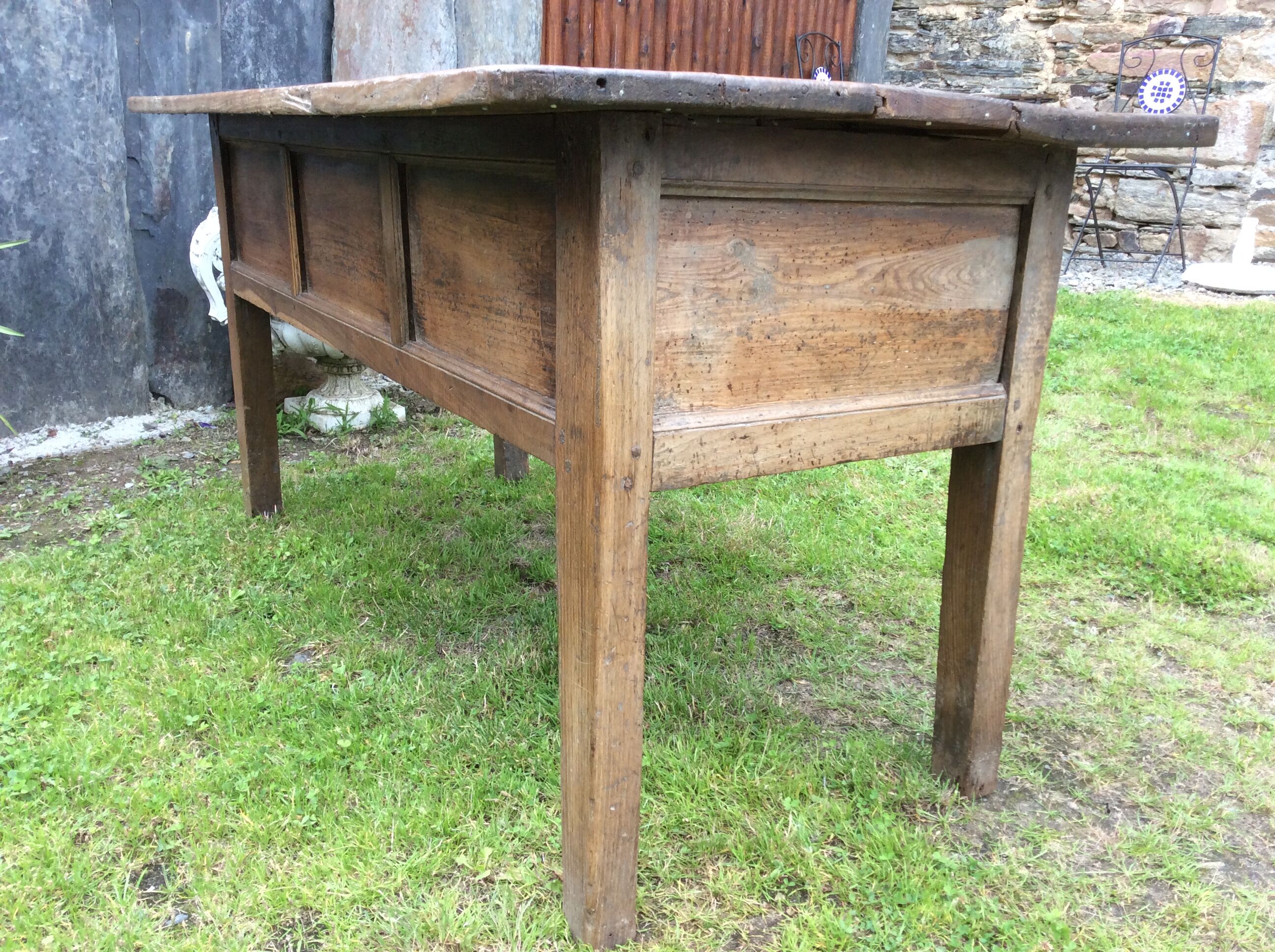 Farm table with panels with oak spindle feet. (said dairy table)
