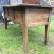 Farm table with panels with oak spindle feet. (said dairy table)