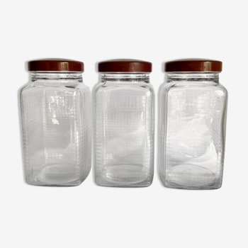 Trio glass gridded jars, vintage cap