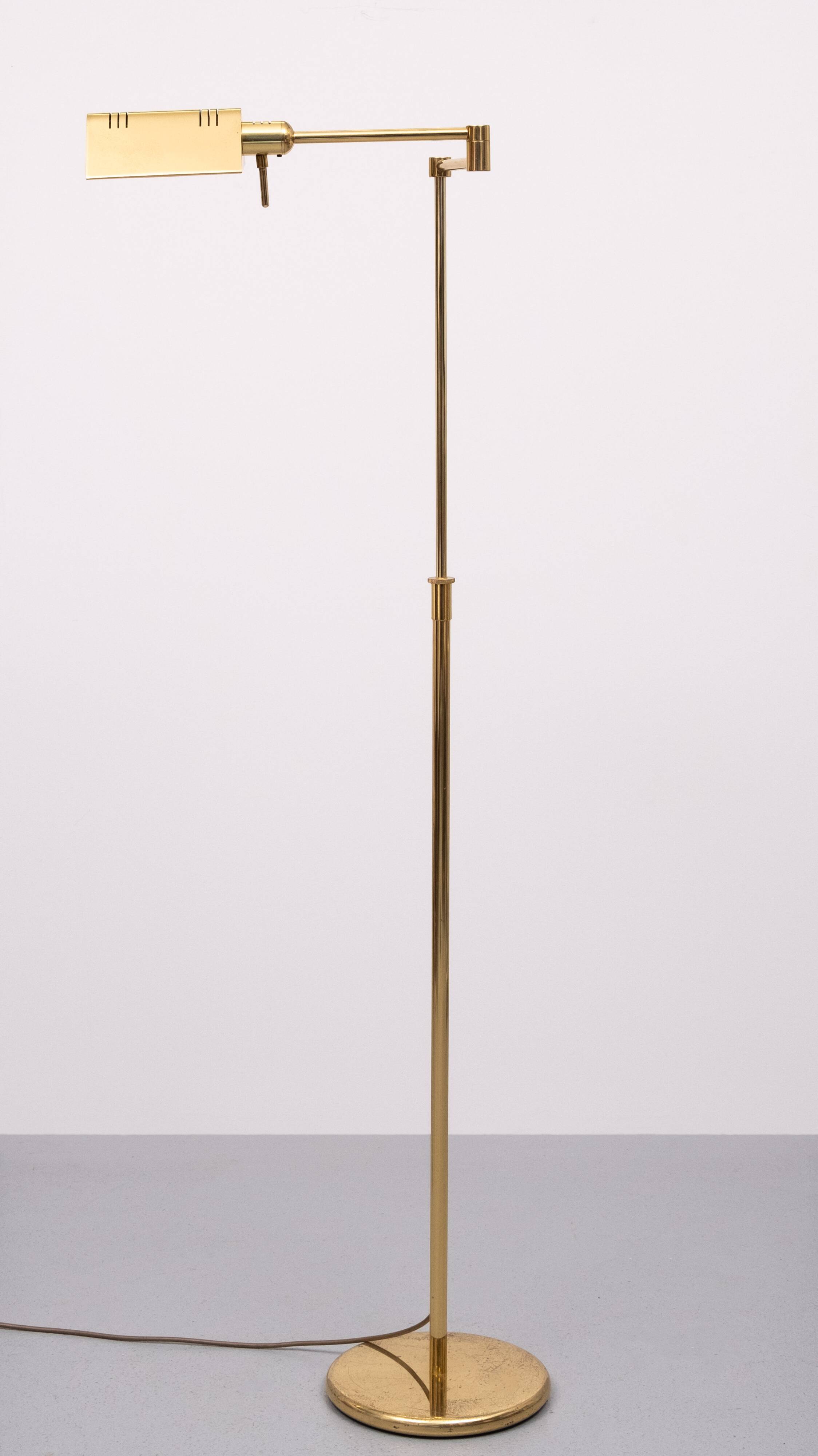 Holtkoetter adjustable Brass swing arm floor lamp. Germany