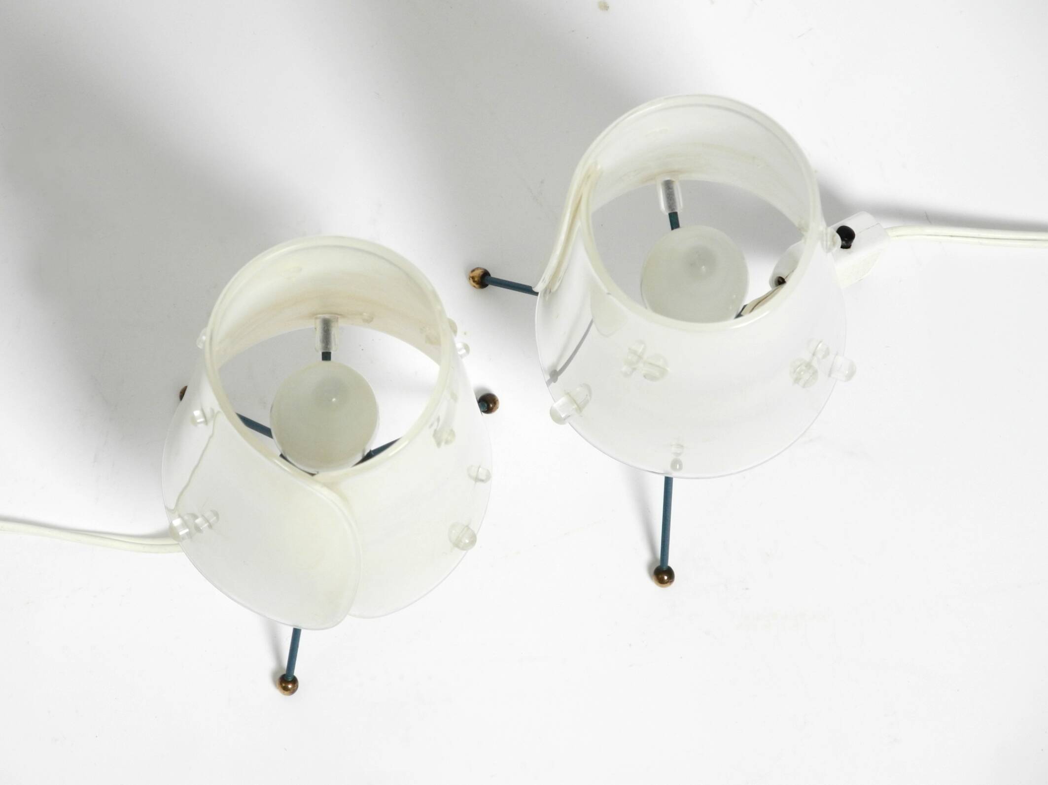 Two very Mid Century Modern tripod table lamps with white plexiglas shades