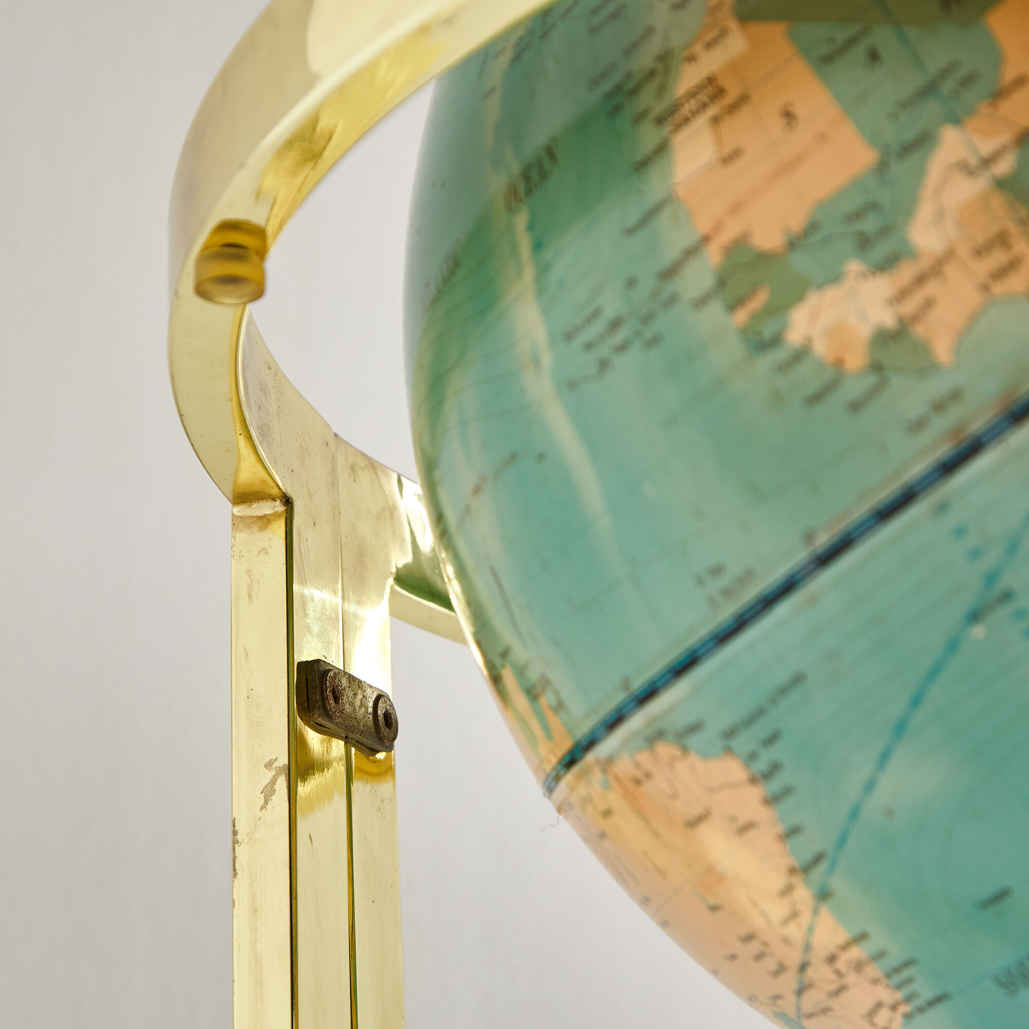 Illuminated globe on brass frame, 1980s