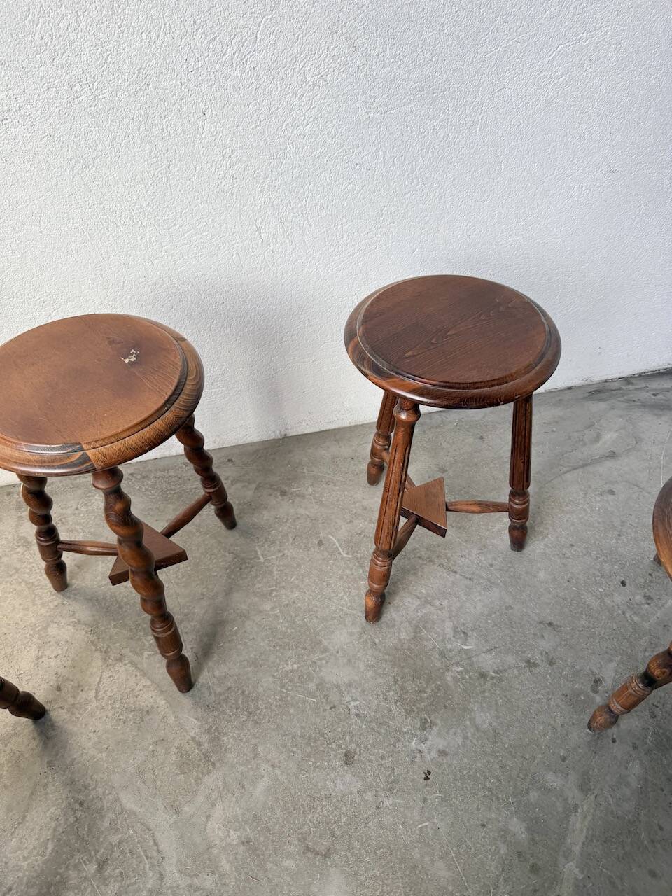 Set of 4 turned oak stools.