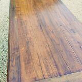 Old French farmhouse table in walnut with turned legs.