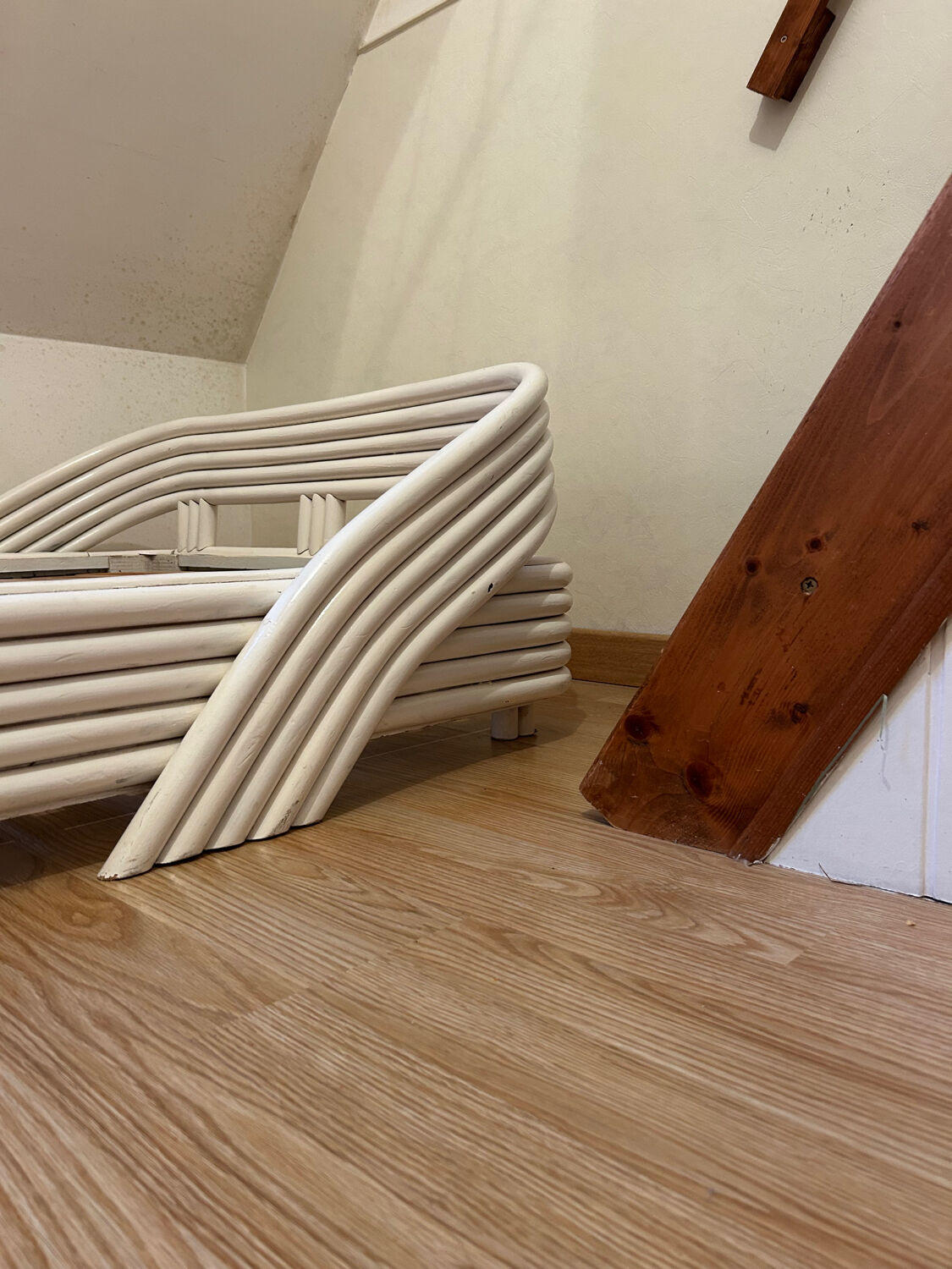 Vintage white rattan bed from the 1960s.