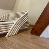 Vintage white rattan bed from the 1960s.