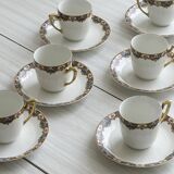 7 Limoges porcelain cups and saucers with gold decoration and floral motif.
