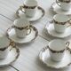 7 Limoges porcelain cups and saucers with gold decoration and floral motif.