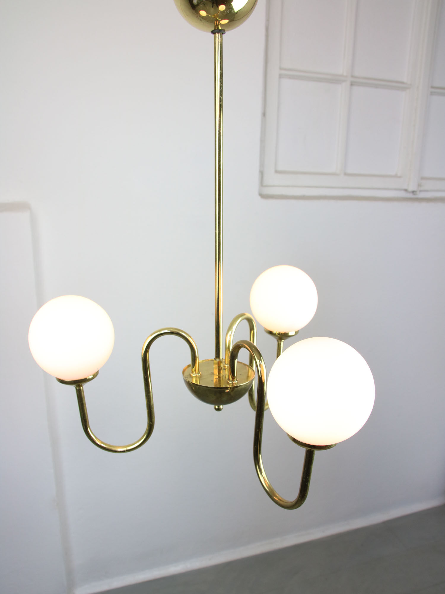 Vintage golden chandelier in opaline glass