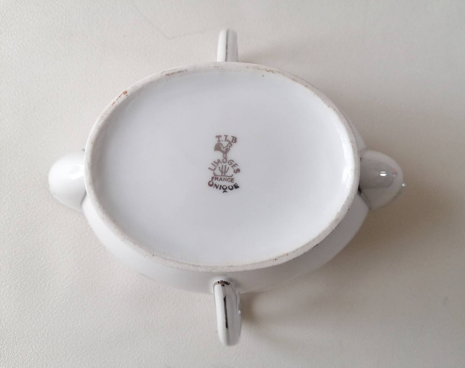 Limoges Maigre Gras porcelain sauce boat with silver decoration