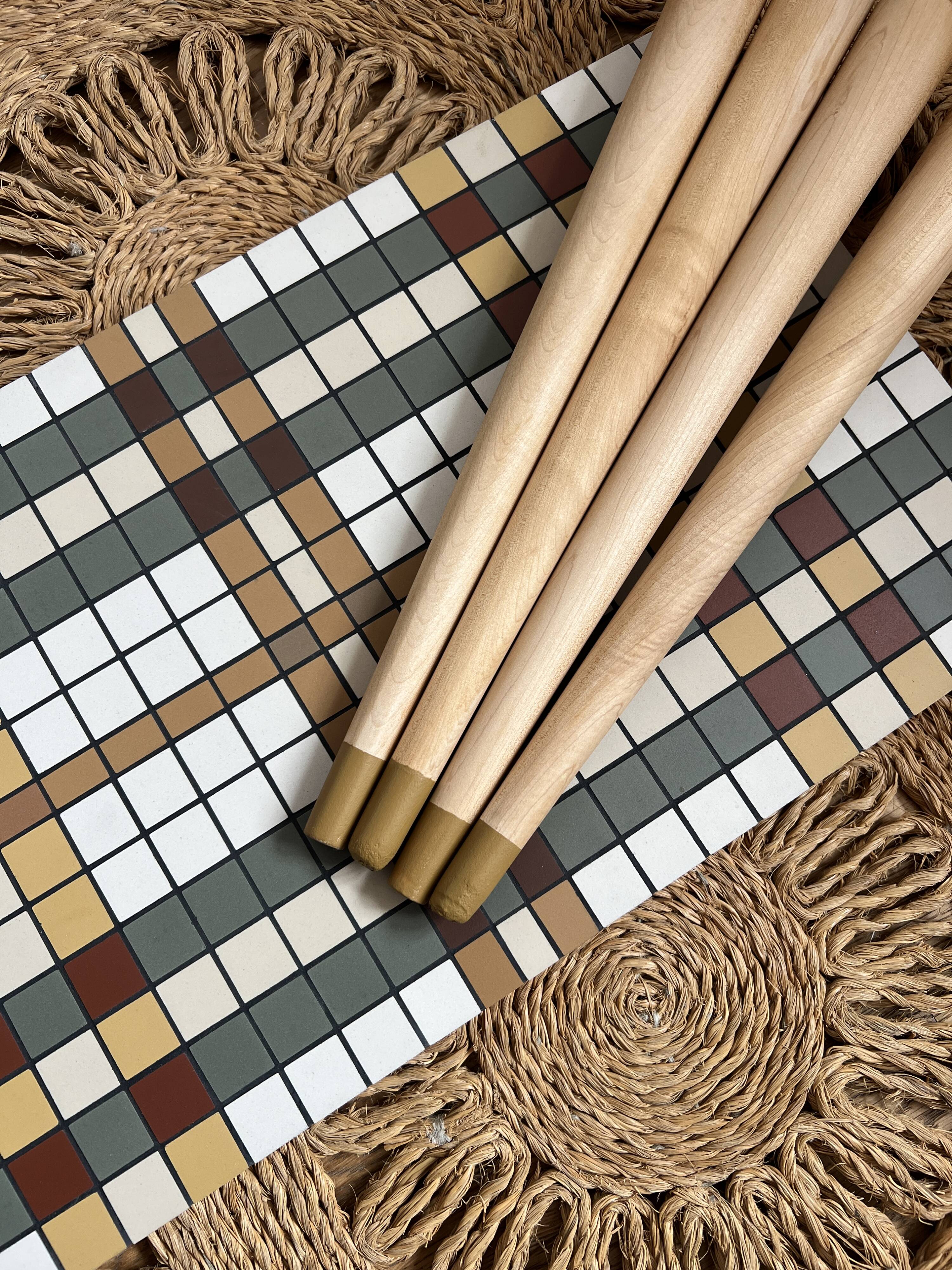 Small mosaic bedside table with tapered legs.