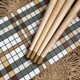 Small mosaic bedside table with tapered legs.