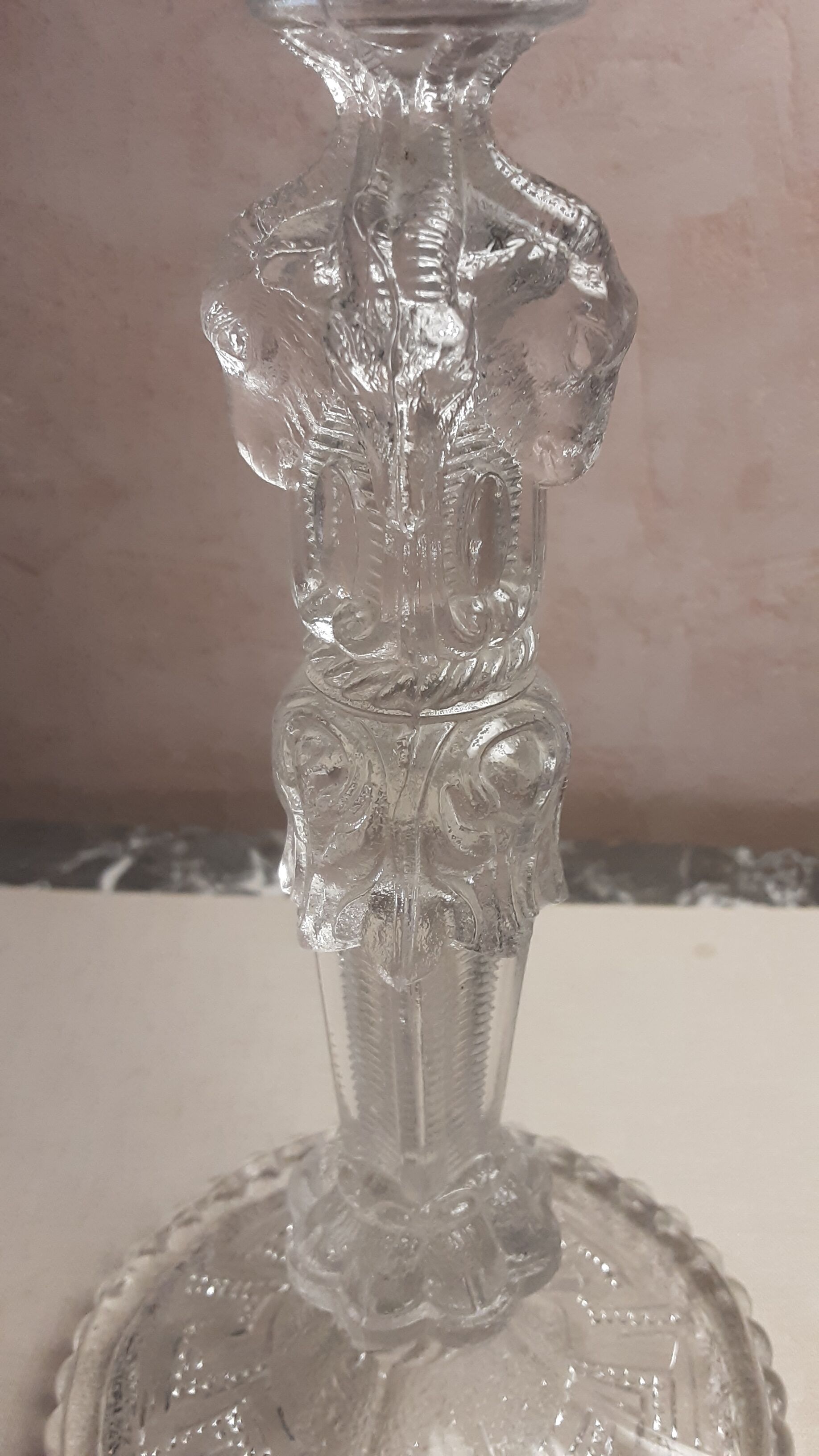 Old push-up in moulded thick glass