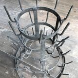 Old metal hedgehog bottle holder