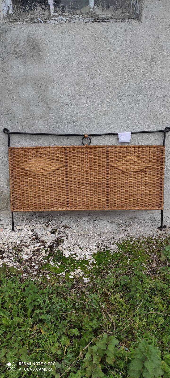Black metal and rattan bed frame