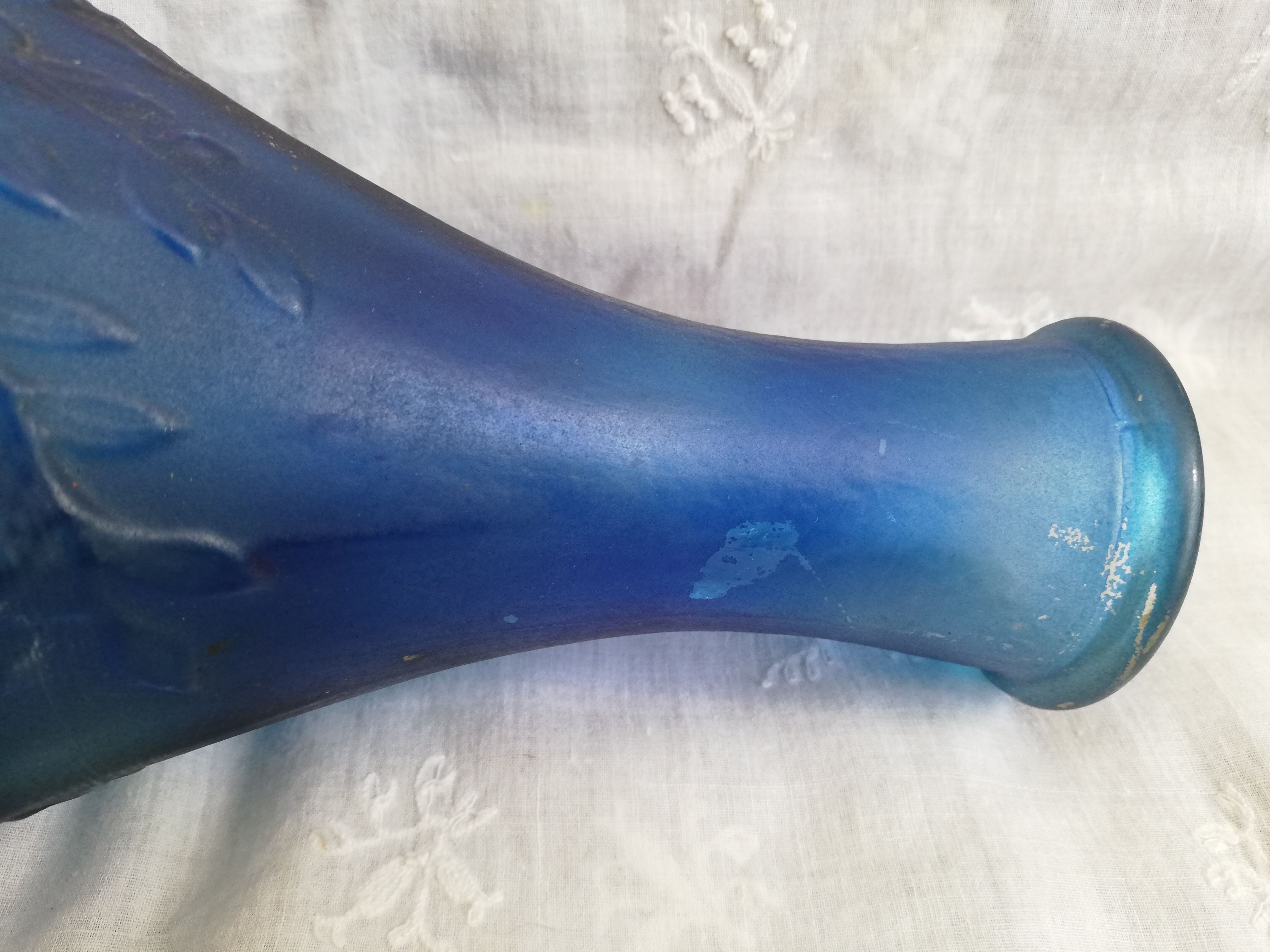Blue glass bottle, engraved molded