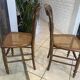 Pair of N2 antique caned and wooden chairs from the 1900s.