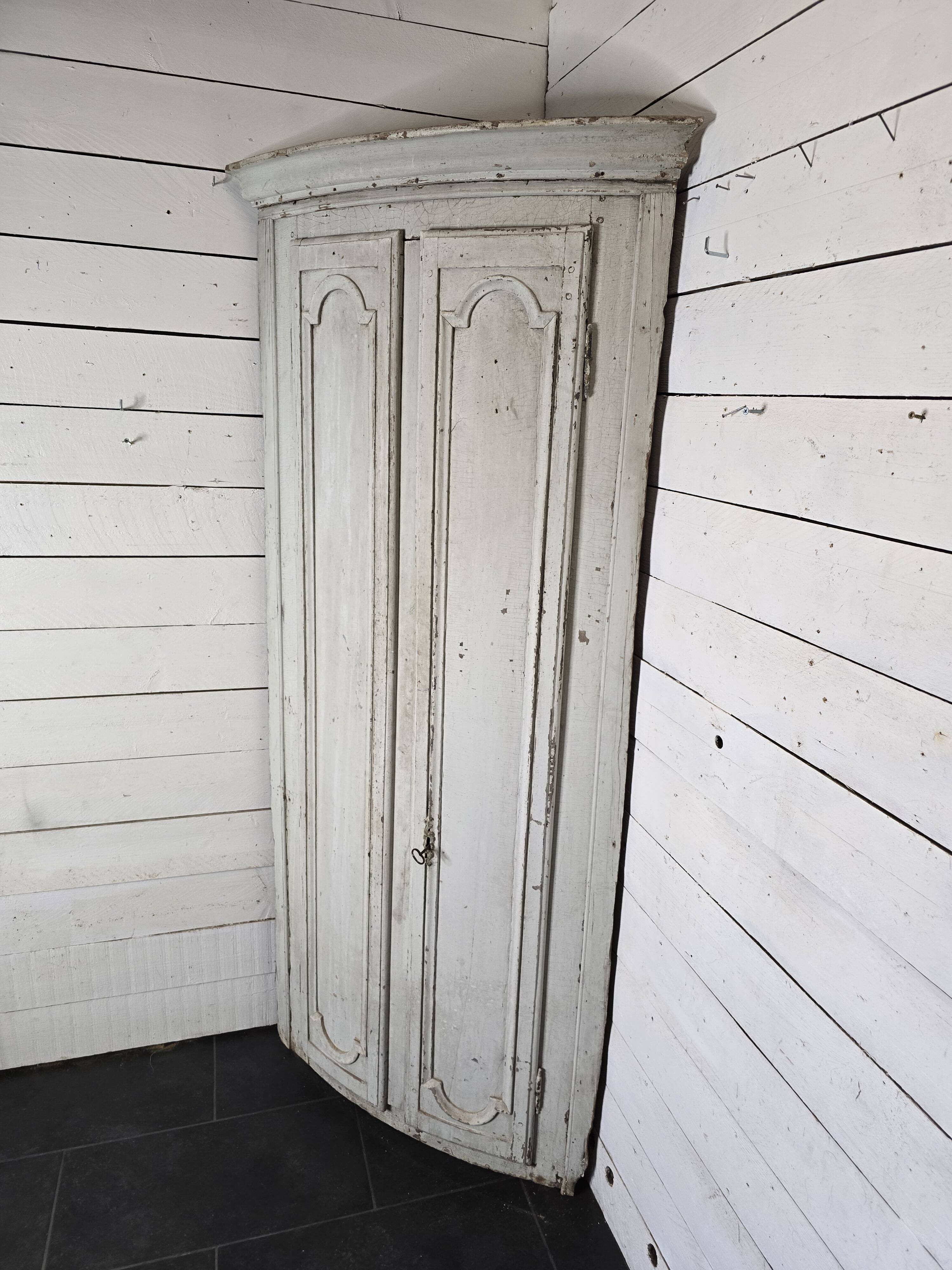 19th century curved corner cupboard in patinated oak