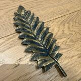 Brass pocket emptier