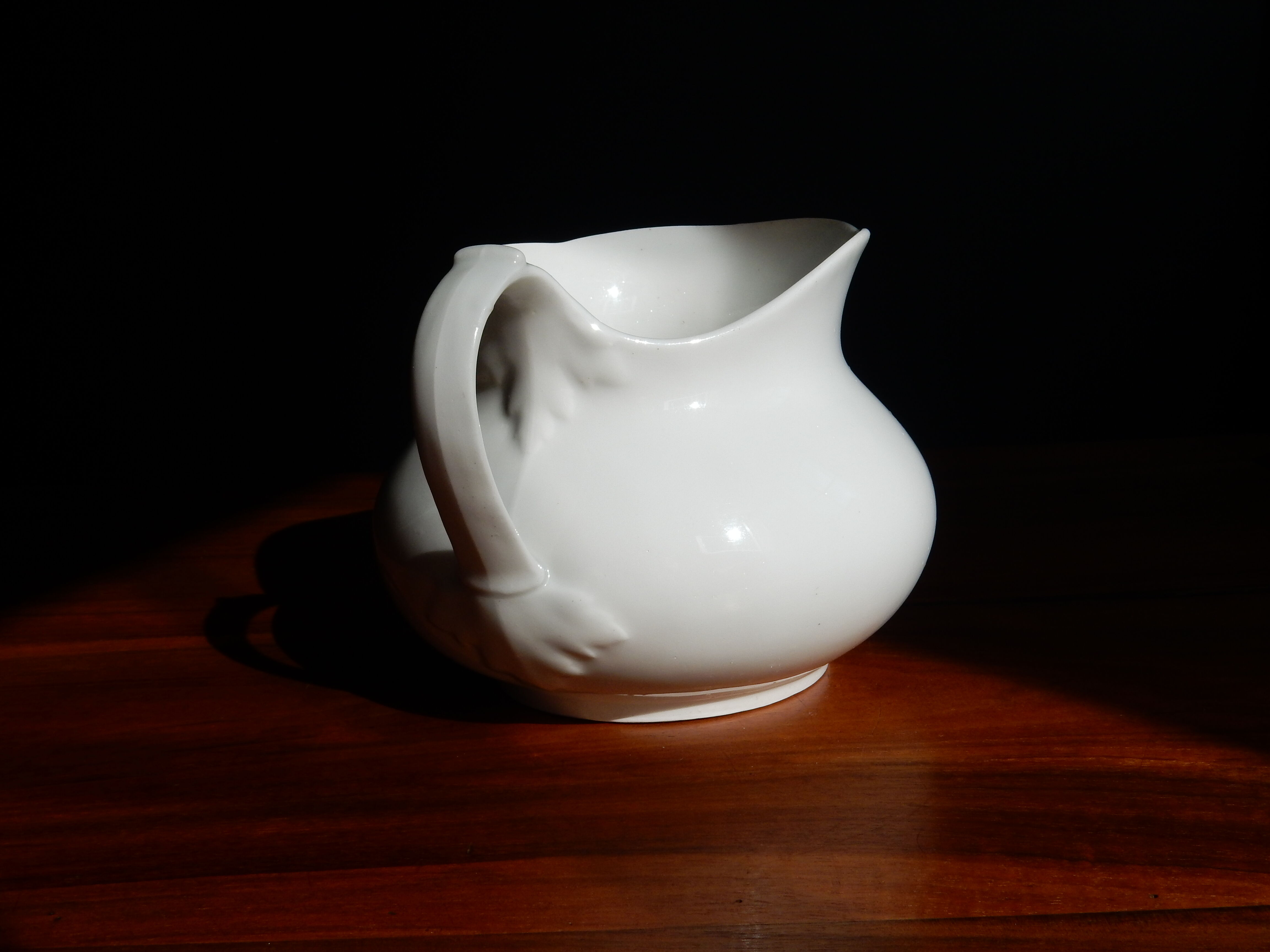 White ceramic water pitcher broc pot