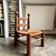 Low brutalist chair in dark wood and straw no. 2