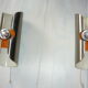 Pair of cylindrical stainless steel wall lamps space age years 70