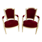 Paire de fauteuils cabriolets style Louis XVI en velours rouge et bois