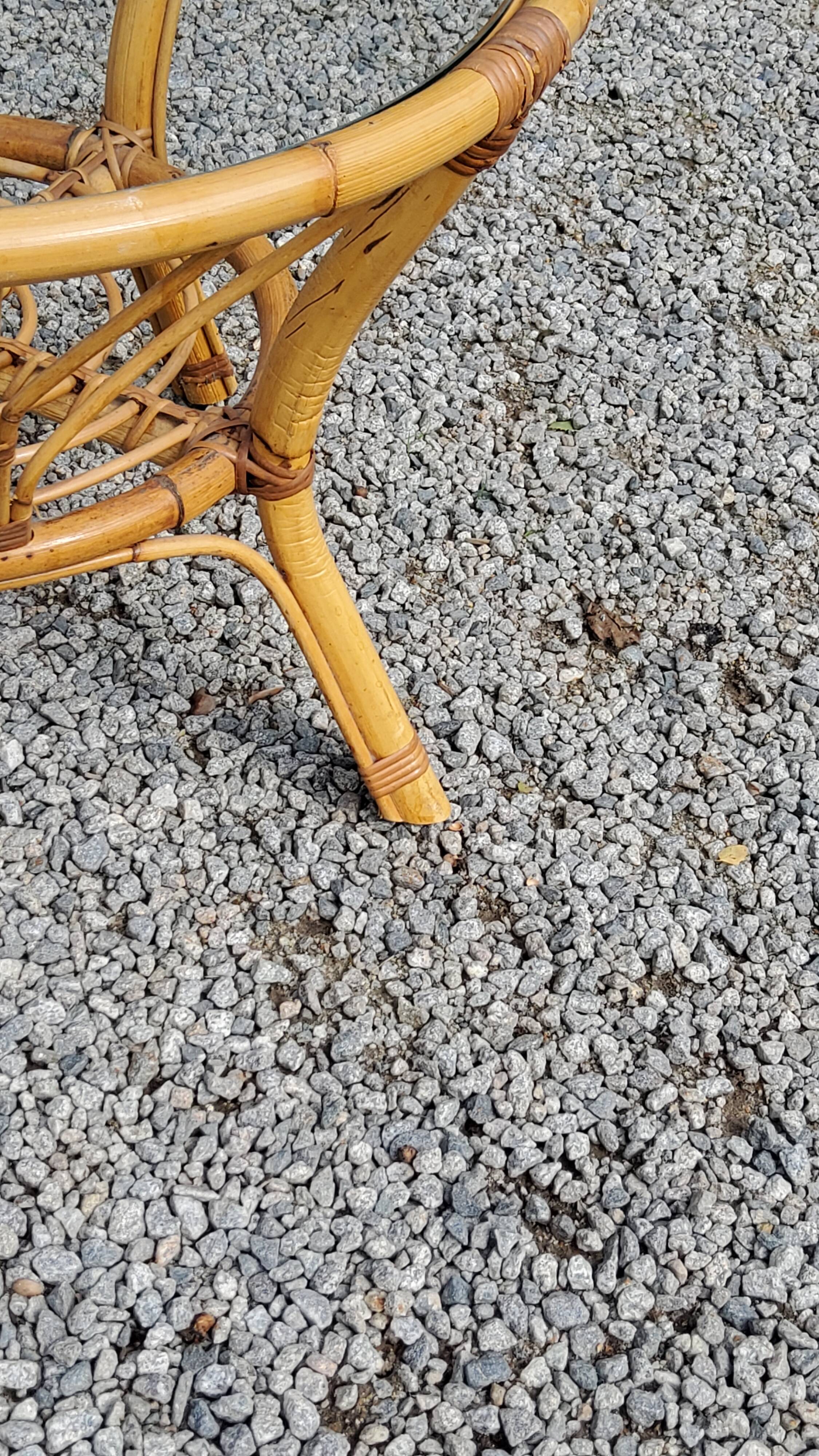 Round rattan coffee table with glass top from the 70s